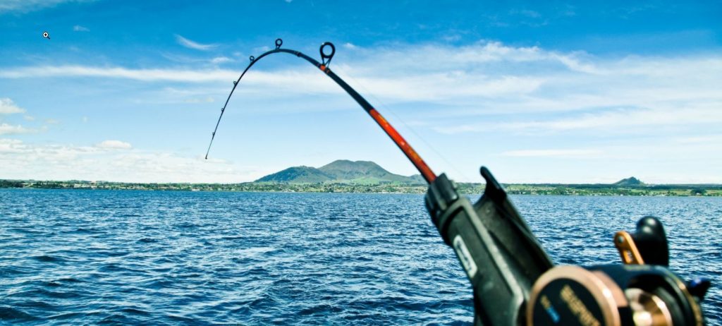 fishing rod resisting against fish