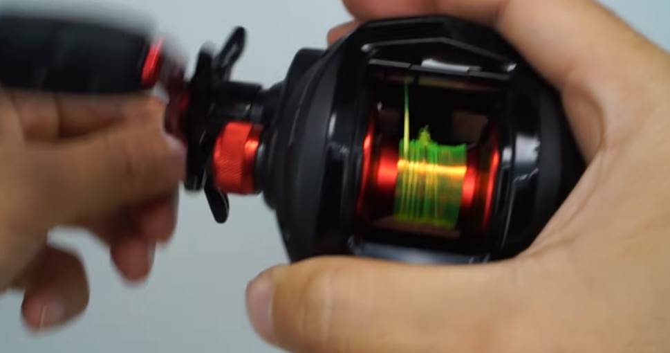 image of spooling a baitcaster reel