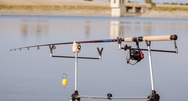 image of fishing rod attached to rod stand